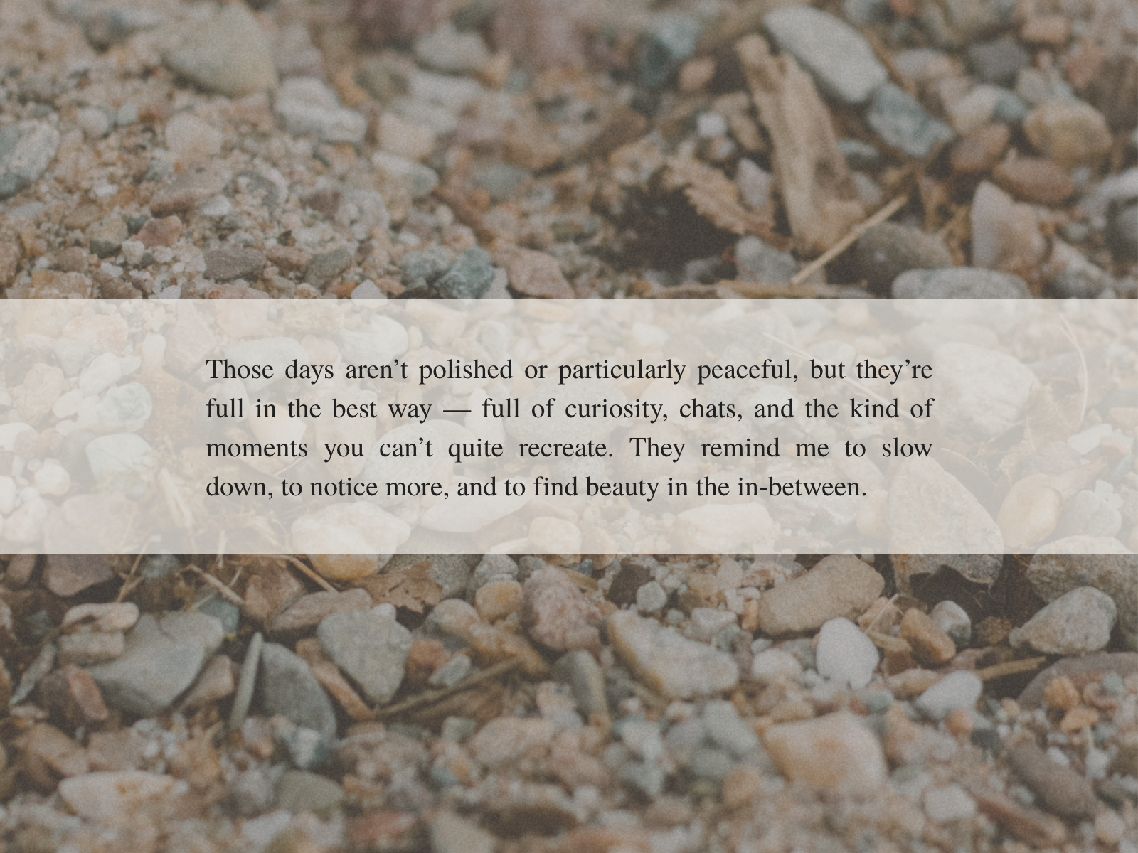 Text overlay on a textured background with pebbles and natural elements