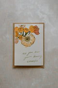 A6 card with floral illustration on top of a Kraft brown envelope