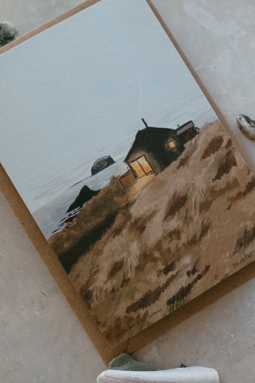 Small cabin on coastal landscape illustration 