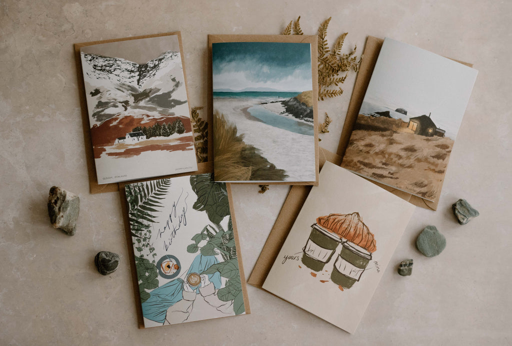 5 greeting cards placed on a natural textured background